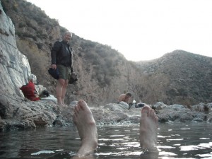 In the natural hot springs.