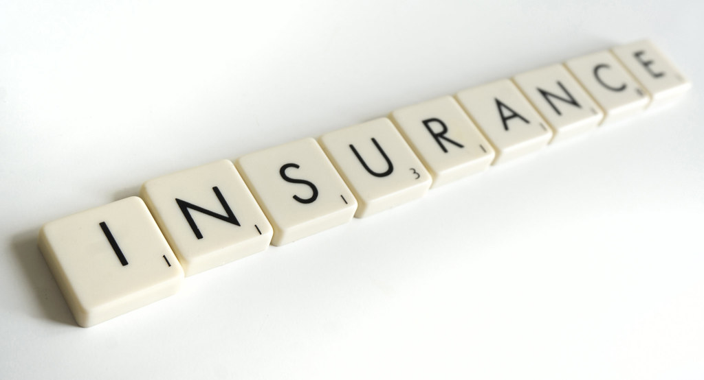 scrabble tiles spelling insurance 