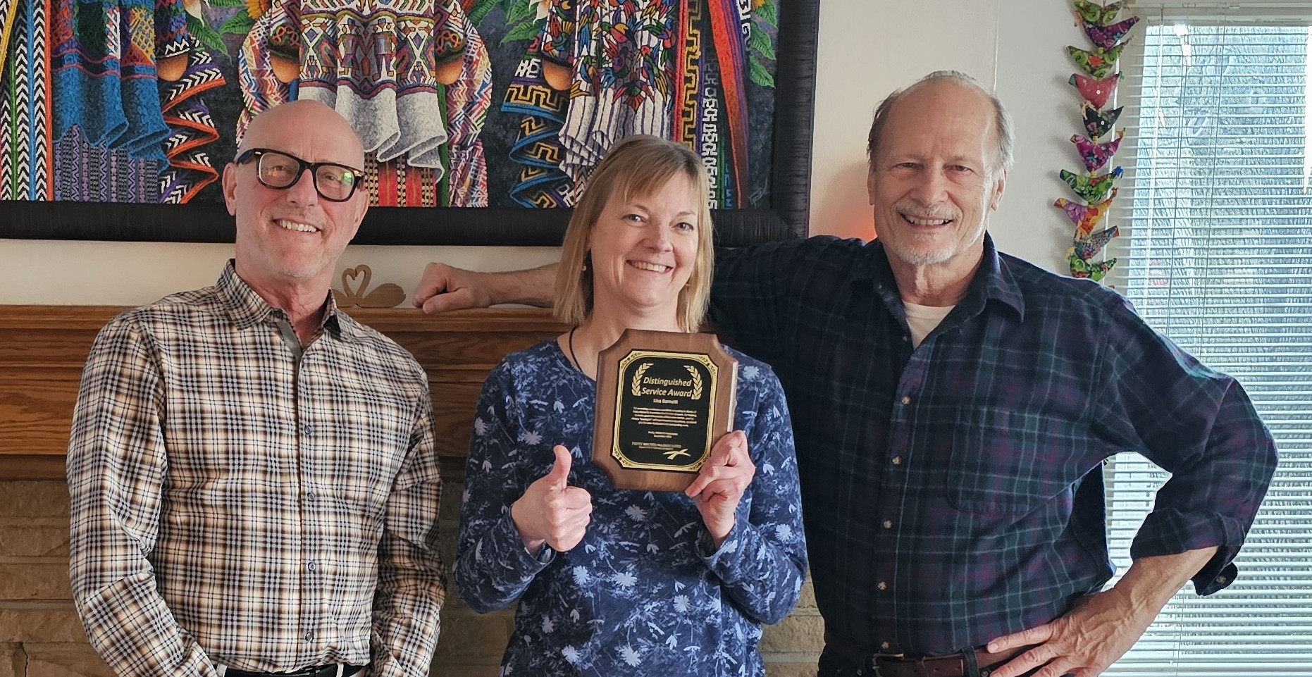 Dave Michel and Ed Petty presenting Lisa Barnett with 10 year service award